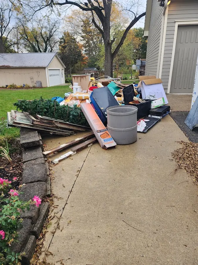 Dumpster being loaded with debris for 30 Yard Dumpster Rental in Tuba City